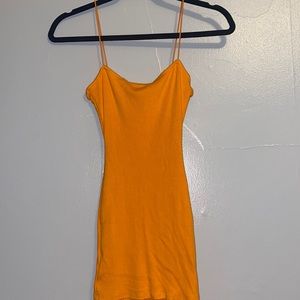 An orange body-con mini-dress from Windsor in a size medium:))